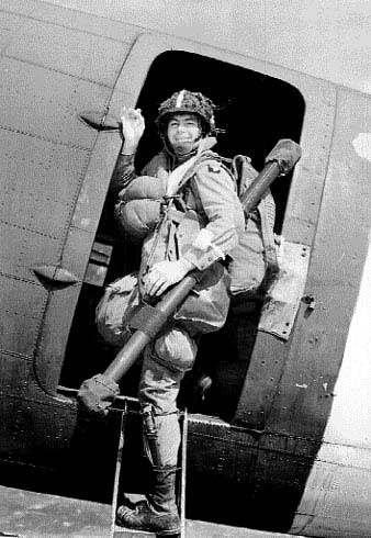 One Happy Soldier With A Bazooka Boarding a C-47.