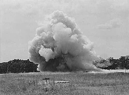 Firing a battery of twenty five Livens projectors. June 1942.