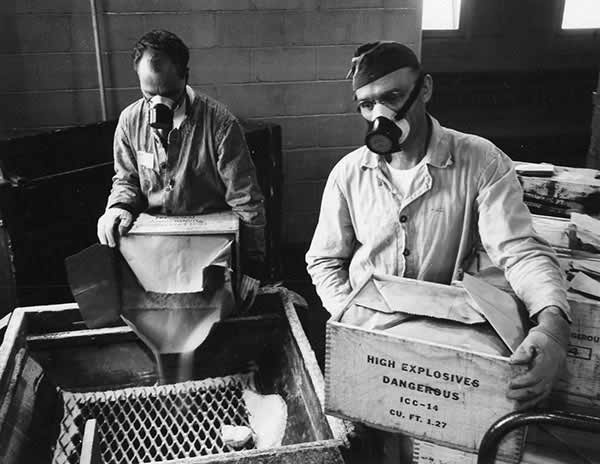 Men with Masks, Boxes of the High Explosive TNT. 04 November, 1943.