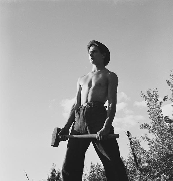 Husky Enrollee Wielding Sledgehammer at Camp Stratford in Baynesville, Virginia.