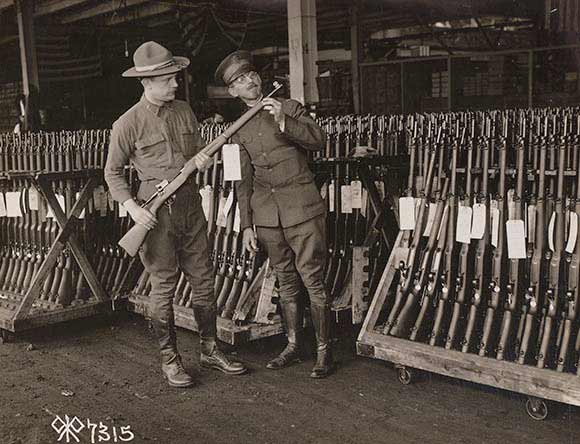 US Army Officers Inspecting Rifles.
