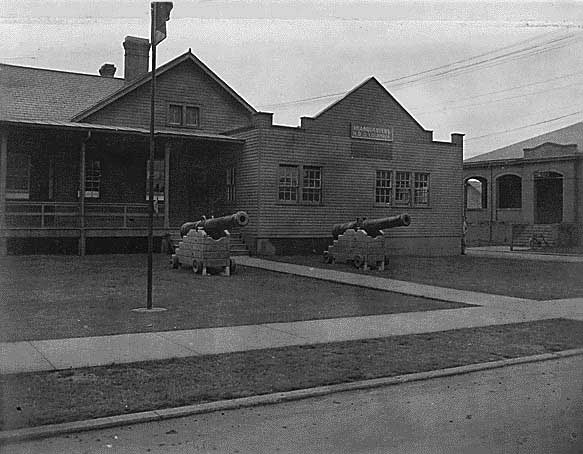 Headquarters, HDC, Fort Stevens, Oregon, with 160 year old, six inch, brass cannon from Spanish fortifications at Manila, Circa 1898.