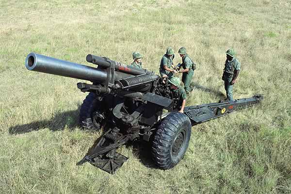 Marines from Kilo Battery, 1st Battalion, 12th Marines, prepare to provide supporting arms fire with an M-114 155mm howitzer during Operation Kernel Blitz. 