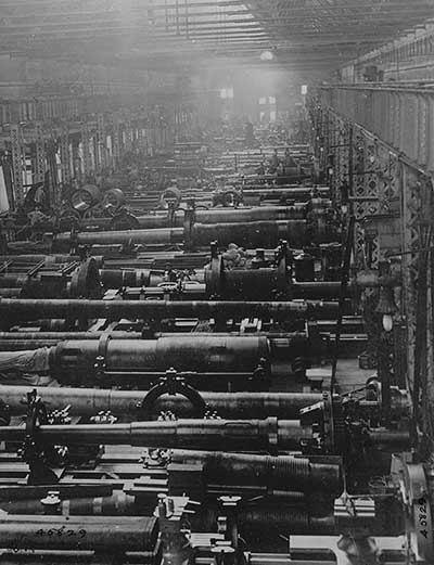 The guns shown here are destined to be used on submarines. A view of interior of a factory which furnished cannon for U.S. Navy.